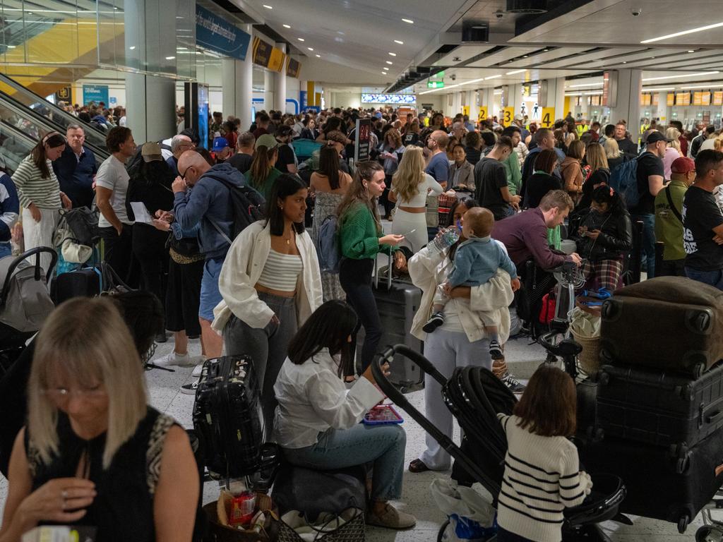People wait near check-in desks at Gatwick Airport on August 28. Picture: Carl Court/Getty Images