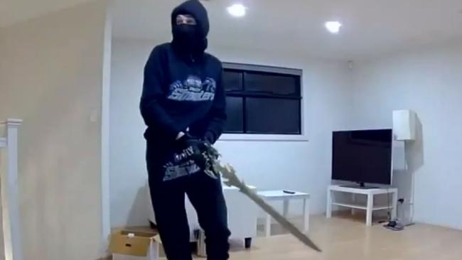 The stylised sword and one of the burglars can be seen here. Picture: 9News