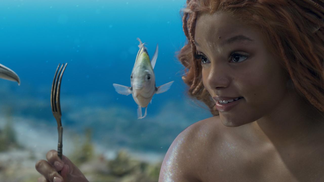 Flounder (voiced by Jacob Tremblay), and Halle Bailey as Ariel in Disney's live-action The Little Mermaid.