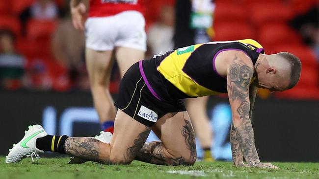 Dusty goes down in agony after sustaining a season ending lacerated kidney. Picture: Michael Klein