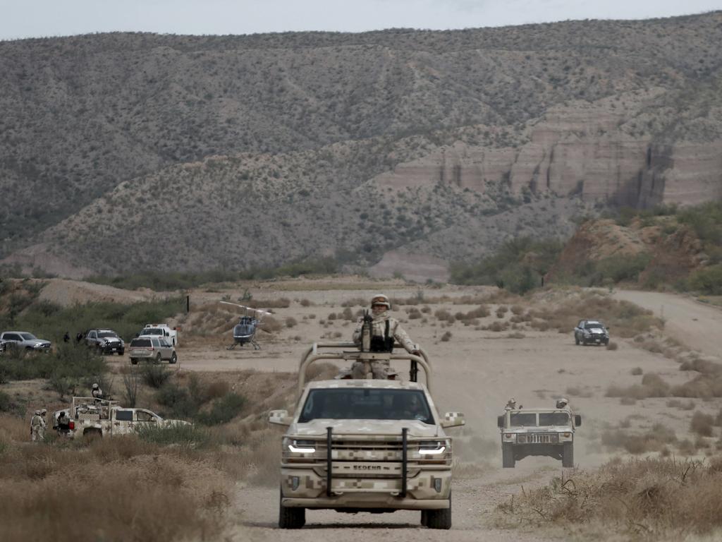 Mexican military patrol in La Mora while the family buried the dead. Picture: Christian Chavez