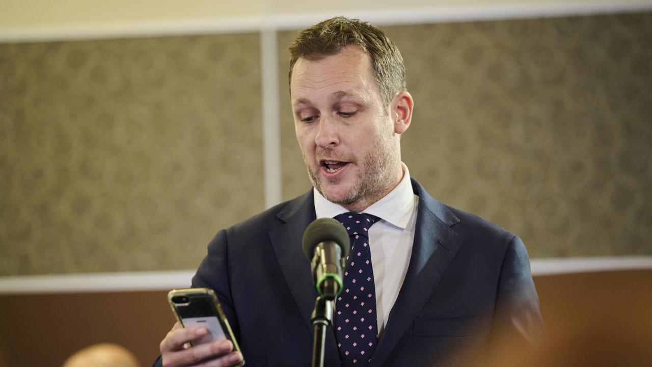 Journalist Peter van Onselen reads out the text messages at the National Press Club. Picture: Rohan Thomson/Getty Images