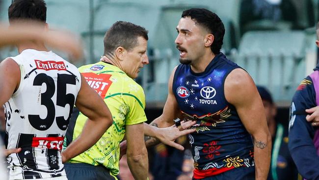 MELBOURNE, AUSTRALIA - MAY 18: Izak Rankine of the Crows disputes an umpiring decision in the dying seconds during the 2024 AFL Round 10 match between The Collingwood Magpies and Kuwarna (Adelaide Crows) at The Melbourne Cricket Ground on May 18, 2024 in Melbourne, Australia. (Photo by Dylan Burns/AFL Photos via Getty Images)