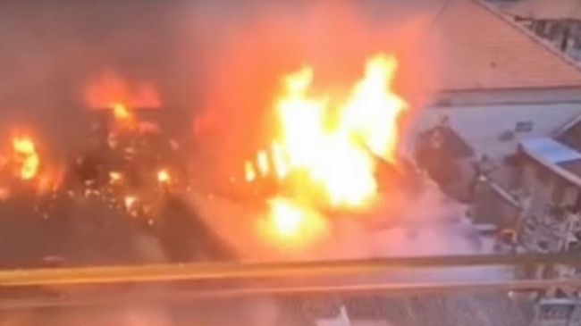 Aussie tourists sprang into action on Saturday when a Balinese building began to burn. Credit: 7NEWS