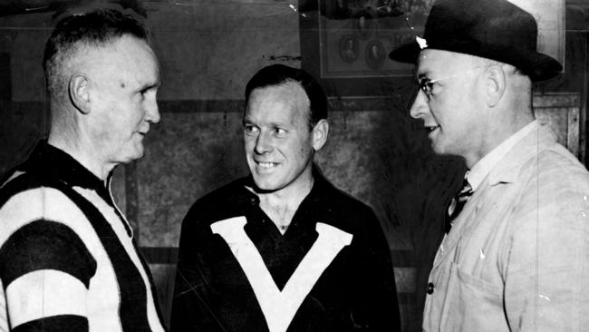 Collingwood coach Jock McHale, player Marcus Whelan and selector Syd Coventry at training in the 1940s.