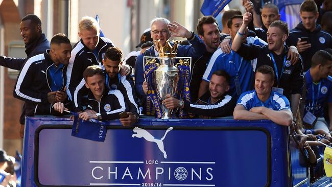 Leicester City drive through the Leicester town centre on an open-top bus to celebrate their EPL title win.