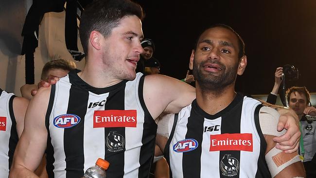 Jack Crisp (left) and Travis Varcoe soak in their second semi-final win. Pic: AAP