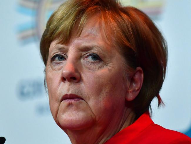 German Chancellor Angela Merkel delivers a statement to journalists after taking part in the Summit of the Business20 (B20) in Berlin on May 3, 2017. The B20 forum is a debate platform to discuss the G20 economies. / AFP PHOTO / John MACDOUGALL