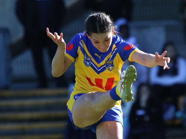 Ambryn Murphy-Haua kicks for City. Picture: Warren Gannon Photography