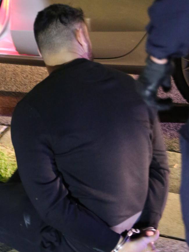 One of the men being arrested. Picture: NSW Police