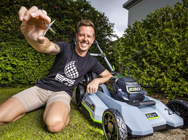 *** Embargoed for SUNDAY PAPERS **V8 Supercars - Background is about the battle between James Courtney and Chaz Mostert on the track. JAMES Courtney with the "Chaz Mostert" lawnmower.Picture: NIGEL HALLETT