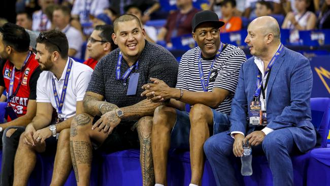 Australian NFL player Jesse Williams (second left) and Bullets legend Leroy Loggins (third left) watch from the sidelines. Picture: AAP