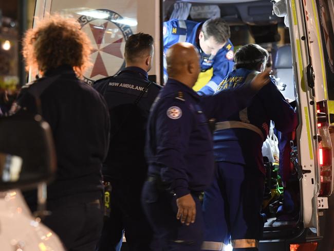 The teenager is stretchered into an ambulance in an induced coma. Picture: Gordon McComiskie