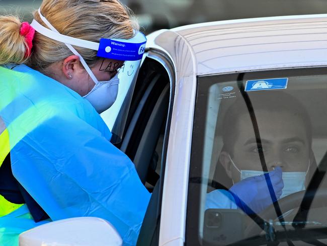 SYDNEY, AUSTRALIA - NewsWire Photos JULY, 03, 2021: Health workers dressed in Personal Protection Equipment (PPE) are seen performing COVID-19 tests at the St Vincent's Drive Through COID-19 testing clinic at Bondi, Sydney. Picture: NCA NewsWire/Bianca De Marchi