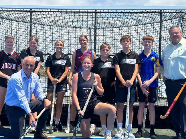 Mackay LNP candidate (front left) and Member for Dawson Andrew Willcox (front right) pose with members of Hockey Mackay after announcing $800,000 in funding for a new indoor facility. Picture: Hockey Mackay Facebook