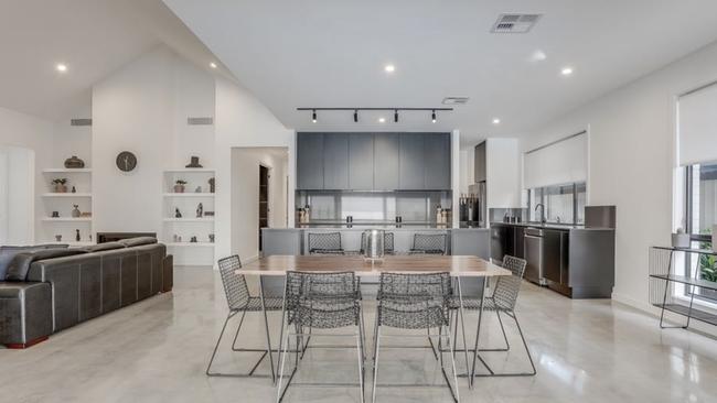 The home was constructed with polished concrete floors, recycled brick feature walls, recycled hardwood timber elements and elevated ceilings. Picture: realestate.com.au