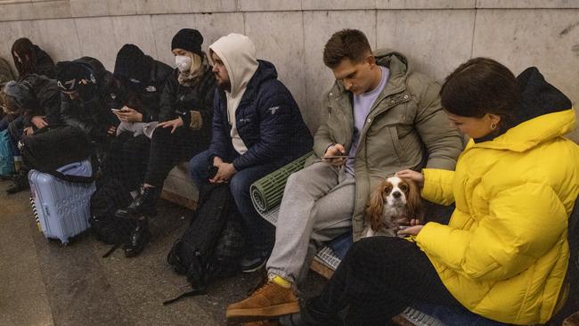 People shelter with their dogs in a subway station in Kyiv. Picture: Chris McGrath/Getty Images