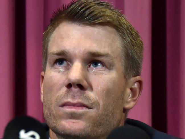 TOPSHOT - Australian cricketer David Warner listens to a question at a press conference at the Sydney Cricket Ground (SCG)  in Sydney on March 31, 2018, after returning from South Africa. Former Australia vice-captain David Warner apologised in tears on March 31 for his role in a ball-tampering scandal and said he would weigh up an appeal against his 12-month ban. / AFP PHOTO / PETER PARKS / -- IMAGE RESTRICTED TO EDITORIAL USE - STRICTLY NO COMMERCIAL USE --