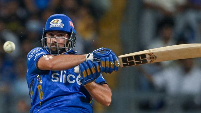 Big hitter Tim David will suit up for Royal Challengers Bengaluru. He was bought for A$547,000. (Photo by INDRANIL MUKHERJEE / AFP)