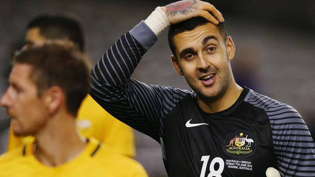 Socceroos goalkeeper Adam Federici, who let a long-range goal fly over his head when ell out on the field, reacts.