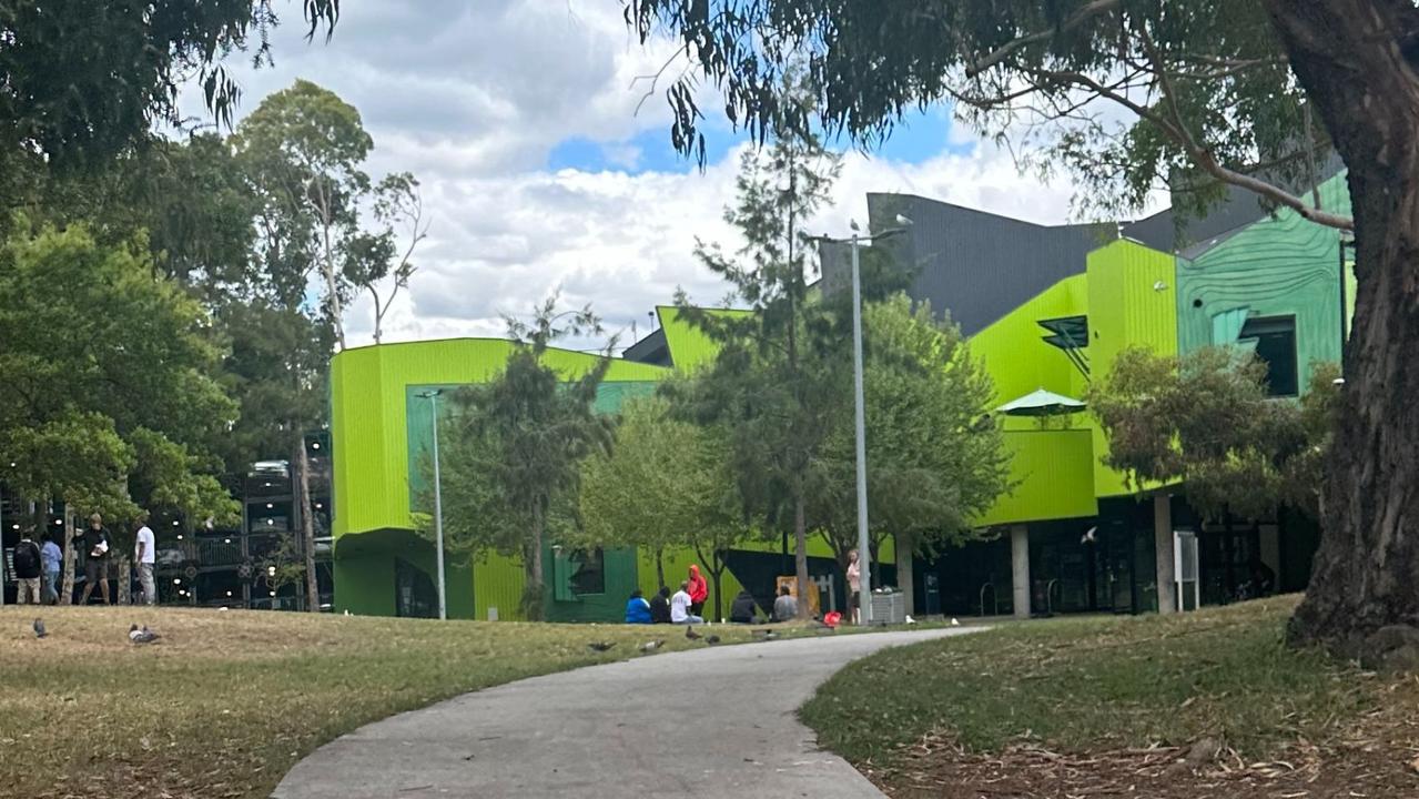 About a dozen people lingered outside the community healthy facility. Picture: news.com.au