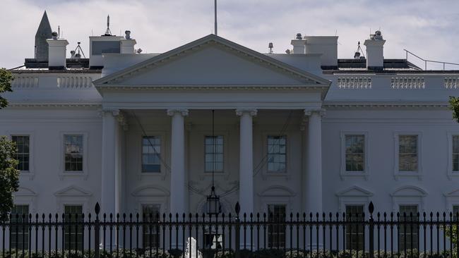 The US flag flies at half-mast above the White House in Washington. Picture: AFP