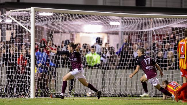 Tom Blackett celebrates Elizabeth Downs’ third goal in its FFA Cup SA quarter-final win over MetroStars. Picture: Adam Butler