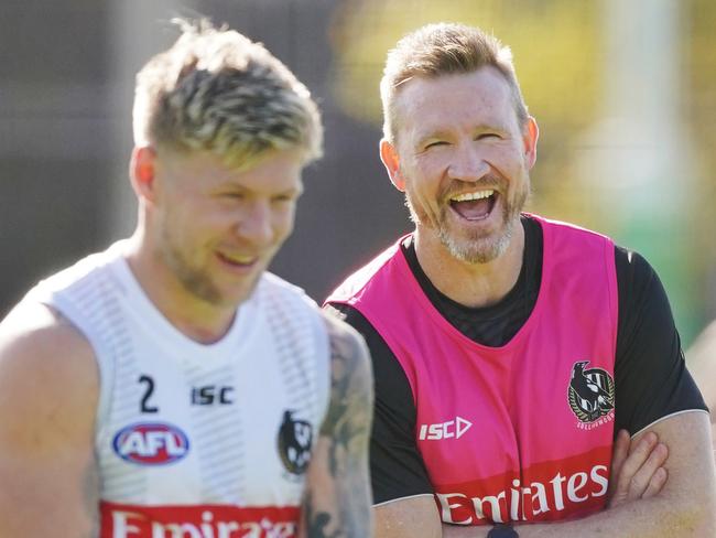 Magpies head coach Nathan Buckley jokes with Jordan de Goey of the Magpies during an Collingwood Magpies training session at the Holden Centre in Melbourne, Monday, May 25, 2020. (AAP Image/Michael Dodge) NO ARCHIVING