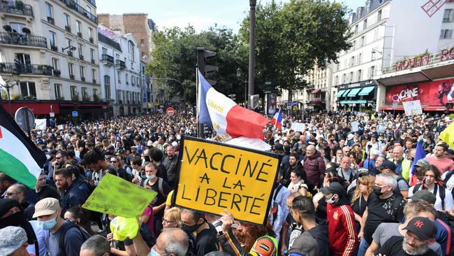 Protesters have taken to the streets of Paris to object to laws banning entry to cafes and transport without a vaccine passport. Picture: AFP