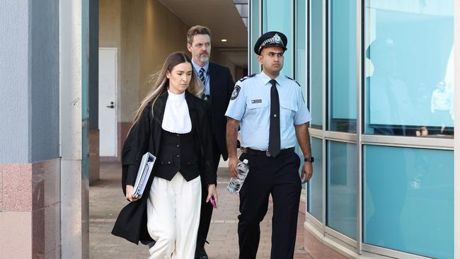 Crown prosecutor Claudia Georgouras leaves the Cairns District Court with Senior Constable Saurabh Verma and another police officer (back) after Mr Verma gave evidence in the trial of Lee Adam Golding on a charge of assault. Picture: Brendan Radke
