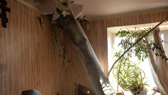The body of a rocket stuck in a flat after recent shelling on the northern outskirts of Kharkiv on February 24, 2022. (Photo by Sergey BOBOK / AFP)