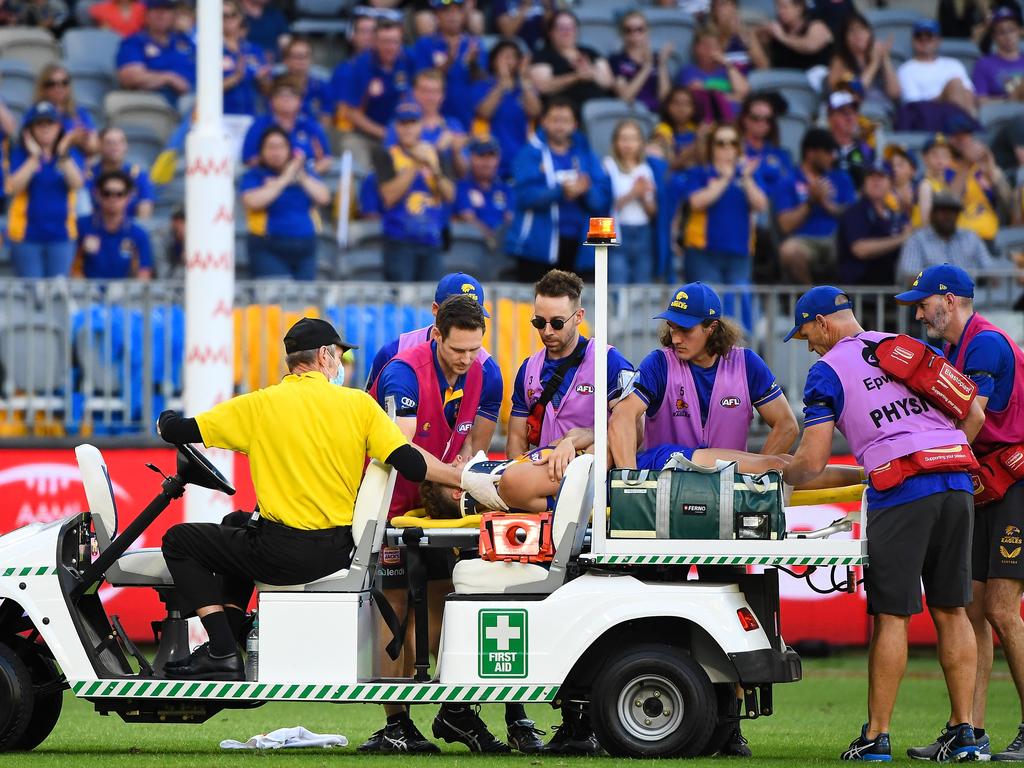 Zac Langdon is loaded onto a medical cart.