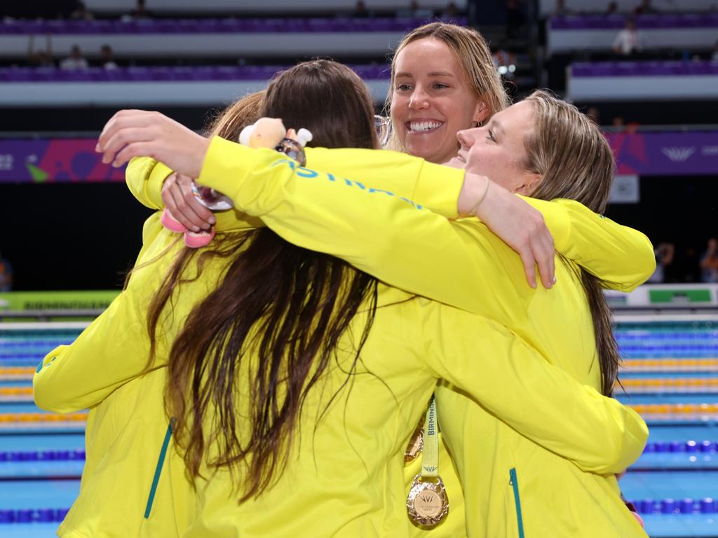 A group hug for the Australian women’s relay team. Picture: Mark Kolbe/Getty Images