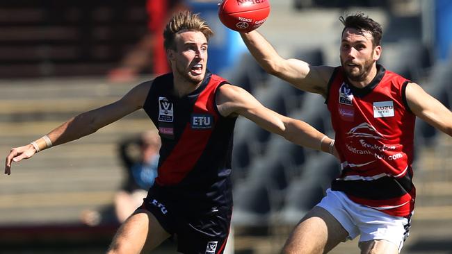 Keenan Posar chases down Frankston's Dylan Clark. Picture: Brendan Francis