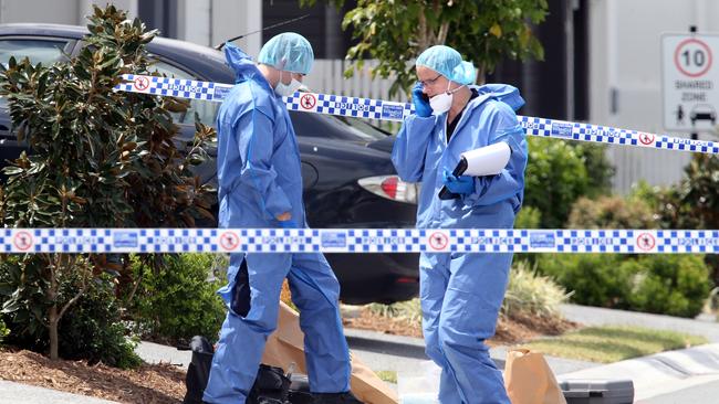 Officers at the Pimpama crime scene. Picture: Richard Gosling