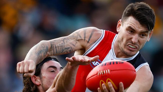 LAUNCESTON, AUSTRALIA - MAY 11: Josh Battle of the Saints is tackled by Jai Newcombe of the Hawks during the 2024 AFL Round 09 match between the Hawthorn Hawks and the St Kilda Saints at UTAS Stadium on May 11, 2024 in Launceston, Australia. (Photo by Michael Willson/AFL Photos via Getty Images)