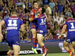 GLORY, GLORY: Newcastle Knights halfback Mitchell Pearce celebrates after kicking the winning field goal. Picture: DARREN PATEMAN