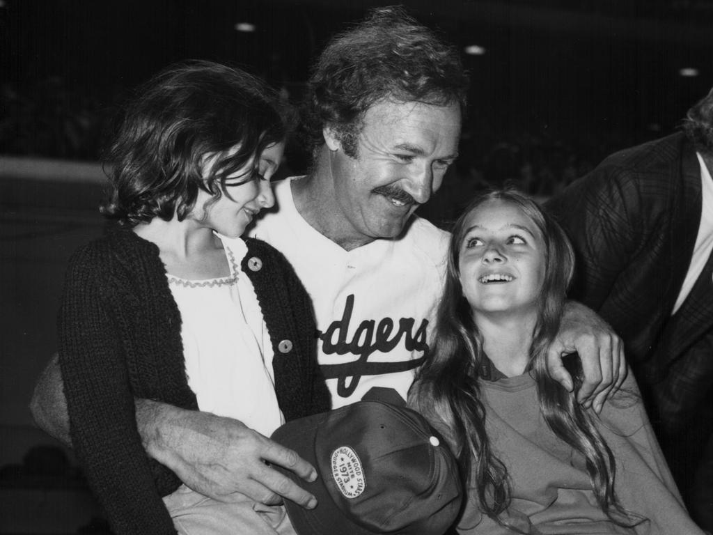 Actor Gene Hackman and his daughters, pictured here attending a celebrity baseball game in Hollywood, California, circa 1975-1985. Picture: Getty Images