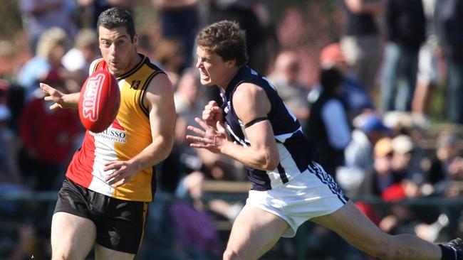 Mark Demasi gets a kick away. Picture: Calum Robertson