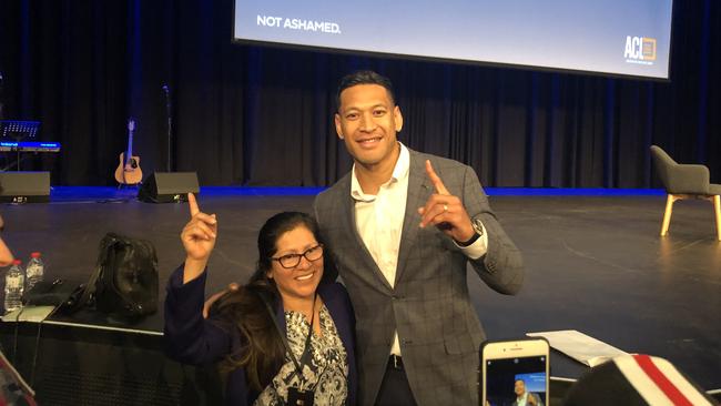 Israel Folau poses for photos with fans before speaking at the Australian Christian Lobby's 'Not Ashamed' conference in Darling Harbour on Saturday. Picture: Brenden Hills.