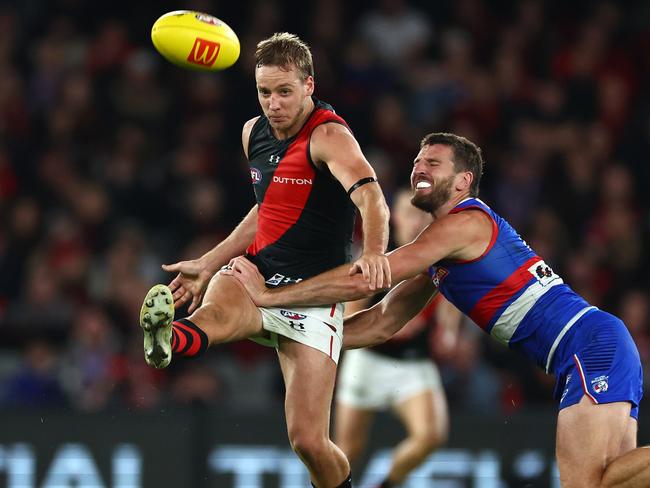 Darcy Parish under pressure from Marcus Bontempelli during Round 5. Picture: Quinn Rooney/Getty Images.