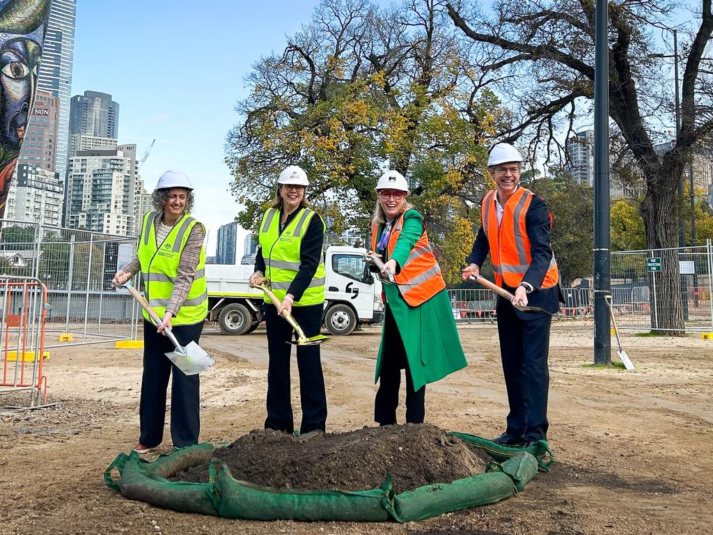 Senator Jess Walsh, federal Infrastructure Minister Catherine King, Lord Mayor Sally Capp and Deputy Lord Mayor Nick Reece turn the sod to mark the start of construction on the Birrarung Marr precinct of the Greenline project – but there’s been no visible progress since.