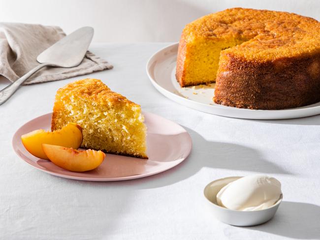 EMBARGO FOR TWAM 11 FEBRUARY 2023. FEE MAY APPLY.  Effortless olive oil cake with fresh peaches. Recipe by Elizabeth Hewson. TWAM exclusive. Photo: Nikki To