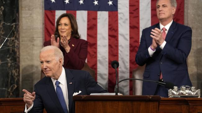 US President Joe Biden delivers the State of the Union address to a joint session of Congress as Vice President Kamala Harris and House Speaker Kevin McCarthy applaud.