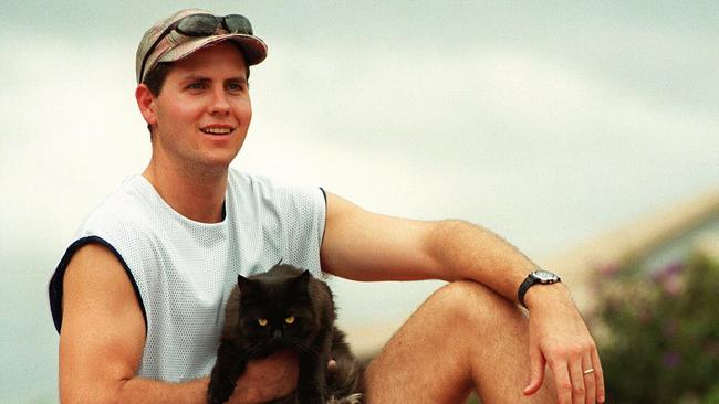 Sport Bris bullets' Rookie Ryan Stolberg relaxes at his /Riverhills home with his cat 