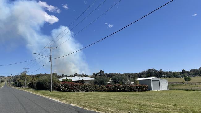 Aircraft, ground crews battle fast-moving grass fire west of Warwick