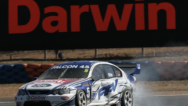 V8 Super car driver Greg Ritter limps back to the pits after crashing in the opening session during Round 6 of the championship. Supercar weekend at Hidden Valley in Darwin is the 350th round of the Australian Touring Car Championship since 1960.