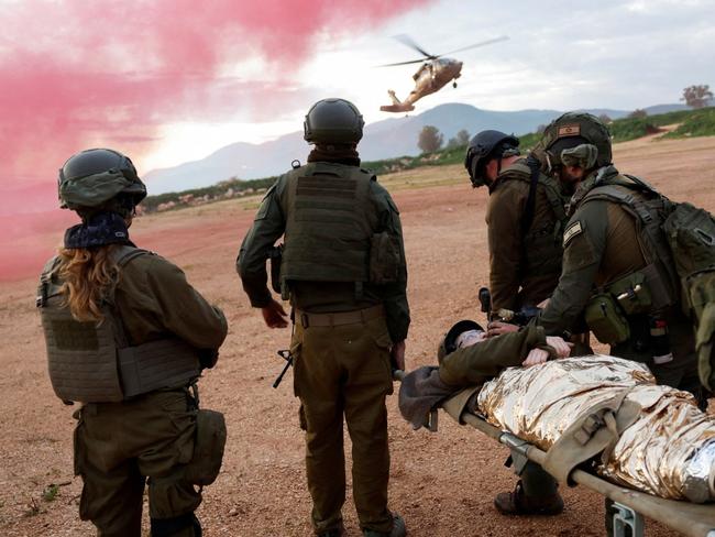 Israeli soldiers practiced evacuating wounded people during a military drill AMIR COHEN/REUTERS