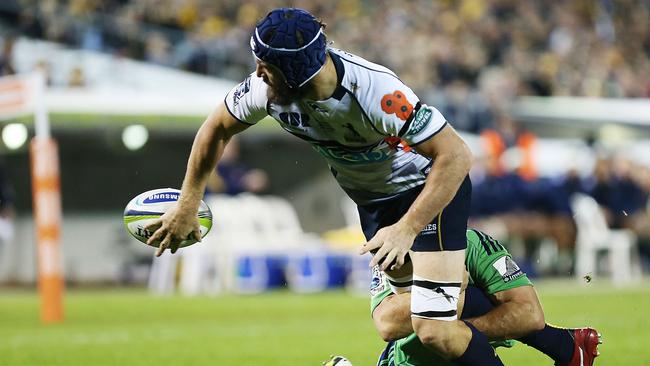 Scott Fardy of the Brumbies offloads the ball