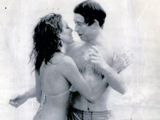 Prince Charles being kissed by a model, Jane Priest on North Cottlesloe beach in 1979.